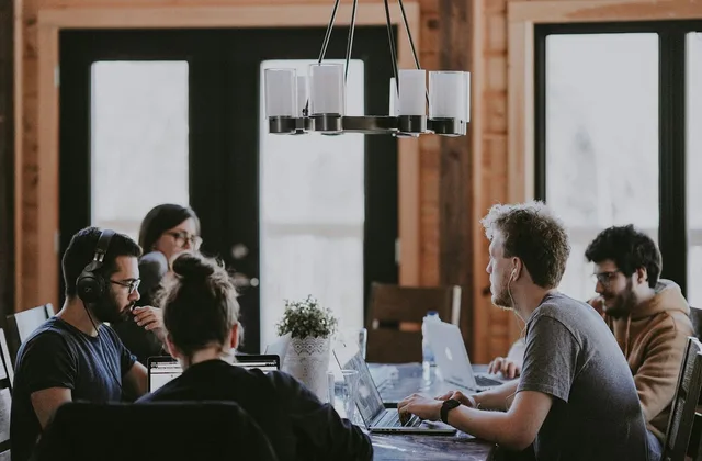 work meeting, office, collaboration, laptop, headphones, modern, discussion, man, woman, youth, creativity, technology, café, teamwork, modern office, group work, interior, light, people. How to read product-led growth for startups case studies