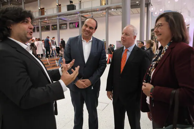 Chargé Logsdon and wife Michelle with Deutsche Telekom's Hagen Rickmann and Cem Ergün-Müller Founder of Startup Night. Startup market research examples for business teams