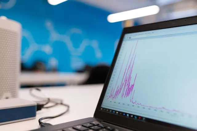 Laptop displaying data analytics graph in a modern office setting, symbolizing growth and technology. Startup marketing metrics tools ranked: which ones earn a place